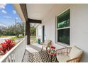 Cozy front porch with comfortable seating and decorative plants at 524 S Grosse Ave, Tarpon Springs, FL 34689