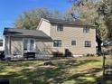 Two-story house with a deck and fenced backyard at 6614 Papa Guy Ln, Plant City, FL 33565