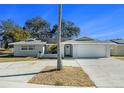Well-maintained house with a two-car garage and solar panels at 11828 Bingham Dr, Port Richey, FL 34668