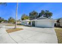 Newly renovated home with a two-car garage and curb appeal at 11828 Bingham Dr, Port Richey, FL 34668