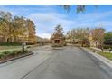 Gated entrance to Stonewood community with guardhouse and landscaping at 125 Falling Water Dr, Brandon, FL 33511