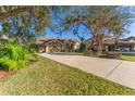 Two-story house with driveway and landscaping at 125 Falling Water Dr, Brandon, FL 33511