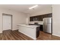 Modern kitchen with stainless steel appliances and island at 19474 Strathcona Ave, Port Charlotte, FL 33954