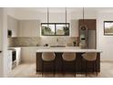 Modern kitchen with island, stainless steel appliances, and marble backsplash at 2100 4Th S St, St Petersburg, FL 33705