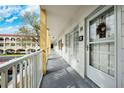 Exterior view of building showing walkway and entry doors at 2430 Florentine Way # 38, Clearwater, FL 33763