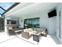 Outdoor kitchen and patio furniture with a covered lanai at 12425 Glenridge Ln, Parrish, FL 34219
