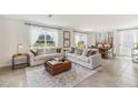 Spacious living room with neutral decor and plenty of natural light at 36101 Sunflower Hill Dr, Zephyrhills, FL 33541