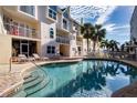 Inviting resort-style pool with ample lounge chairs at 443 Pinellas Bayway S # 105, Tierra Verde, FL 33715