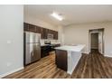 Modern kitchen with stainless steel appliances and island at 5127 Tower St, North Port, FL 34291