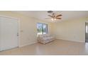 Simple living room with tiled floors and a sofa at 7061 Denmark St, Englewood, FL 34224