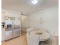 Kitchen with breakfast nook and stainless steel refrigerator at 718 Gulf Blvd # 2, Indian Rocks Beach, FL 33785