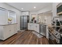 Modern kitchen featuring stainless steel appliances and white cabinets at 764 Captiva Ne Ct, St Petersburg, FL 33702