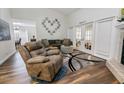 Relaxing living room with a cozy recliner and hardwood floors at 764 Captiva Ne Ct, St Petersburg, FL 33702