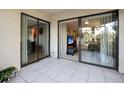 Sliding glass doors open to a private patio area at 113 Woodlake Wynde # 19, Oldsmar, FL 34677