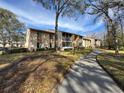 Condo building with landscaping and walkway at 12218 Fox Chase Dr # G2, Hudson, FL 34669