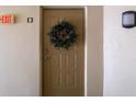 Condo entry door with a decorative wreath at 1398 Shady Pine Way # E3, Tarpon Springs, FL 34688