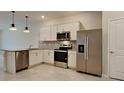 Modern kitchen featuring stainless steel appliances and granite countertops at 31424 Amberview Bend, Wesley Chapel, FL 33545