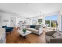 Bright living room featuring hardwood floors, modern furnishings, and an open concept design at 644 3Rd S Ave # 305, St Petersburg, FL 33701