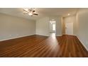 Spacious living room featuring hardwood floors and a ceiling fan at 7849 Grafton Rd, North Port, FL 34291
