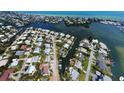 Wide aerial showcasing waterfront homes and canals at 8310 Marina Dr, Holmes Beach, FL 34217