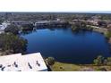 Aerial view of condo community beside a lake at 833 N Keene Rd # W12, Clearwater, FL 33755