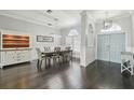 Elegant dining room with hardwood floors, a large table, and a stylish light fixture at 10524 Greencrest Dr, Tampa, FL 33626