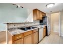 Kitchen with stainless steel appliances and wood cabinets at 12189 Armenia Gables Cir # 12189, Tampa, FL 33612