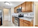 Kitchen with stainless steel appliances and wood cabinets at 12189 Armenia Gables Cir # 12189, Tampa, FL 33612