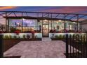 Outdoor living at its finest with a screened lanai, bar, tv, and ample seating for entertaining or relaxation at 1902 4Th E St, Palmetto, FL 34221