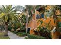 Building exterior with a walkway and tropical landscaping at 200 4Th S Ave # 139, St Petersburg, FL 33701