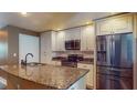 Modern kitchen with granite countertops, stainless steel appliances, and an island at 200 4Th S Ave # 139, St Petersburg, FL 33701
