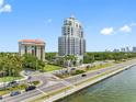 Upscale condominium building featuring lush landscaping and convenient street access at 2109 Bayshore Blvd # 704, Tampa, FL 33606