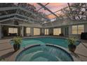 Relaxing pool and spa area with covered lanai at 363 Sanctuary Dr, Crystal Beach, FL 34681