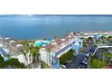 Aerial view of the condo complex and community amenities including waterfront views and a swimming pool at 5155 S Isla Key S Blvd # 202, St Petersburg, FL 33715