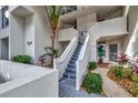 Exterior view showing stairs and landscaping at 5155 S Isla Key S Blvd # 202, St Petersburg, FL 33715