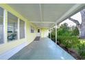 Covered patio with access to the home and backyard at 6021 Ridgewood Dr, Zephyrhills, FL 33542