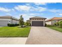 House exterior with landscaping and driveway at 11111 Callisia Dr, Odessa, FL 33556