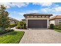 Attached garage with paver driveway at 11111 Callisia Dr, Odessa, FL 33556