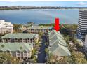 Aerial view of waterfront condo community, showcasing building and water access at 1203 Bay Club Cir # 1203, Tampa, FL 33607
