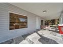 Front porch with tiled flooring and a view of the front door at 1318 E Louise Ave, Tampa, FL 33603
