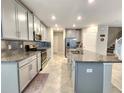 Spacious kitchen with granite countertops and stainless steel appliances at 17009 Clear Cork Dr, Wimauma, FL 33598