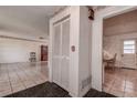 Interior hallway with tiled floors and access to other rooms at 1760 Kenesaw Ln, Clearwater, FL 33765