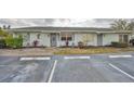 Exterior view showing two attached homes with parking in front at 210 Gloucester Blvd, Sun City Center, FL 33573