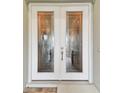 Elegant double front doors with etched glass details at 23 Concord Dr, Dunedin, FL 34698