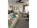 Bright living room features comfy seating and a dining area at 3540 42Nd S St # C, St Petersburg, FL 33711