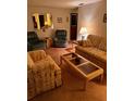 Living room featuring two sofas, end tables, and a coffee table at 4031 Cluster Dr, Holiday, FL 34691