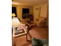 Living room with seating area and entertainment center at 4031 Cluster Dr, Holiday, FL 34691