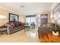 Bright living room with two sofas, coffee table, and large mirror at 5040 Victoria Ln, Holiday, FL 34690