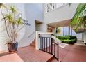 Building entrance with stairs and landscaping at 7871 Sailboat Key S Blvd # 107, South Pasadena, FL 33707