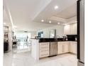 Modern kitchen featuring stainless steel appliances and marble flooring at 855 Bayway Blvd # 804, Clearwater Beach, FL 33767